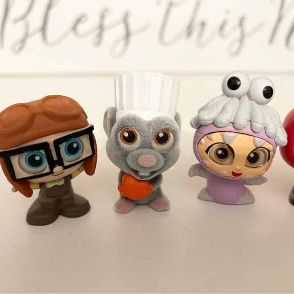 FREE w/purchase Pixar doorables | Young Carl & Ellie , Remy , Boo , Miguel - Picture 3 of 5